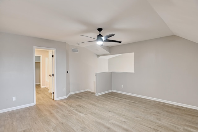 interior space with ceiling fan, lofted ceiling, and light wood-type flooring