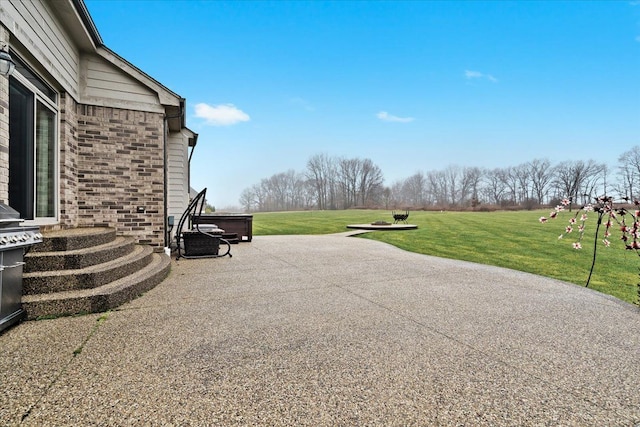 view of patio with a jacuzzi