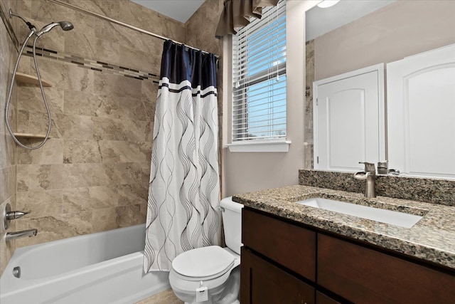 full bathroom with toilet, vanity, and shower / tub combo with curtain