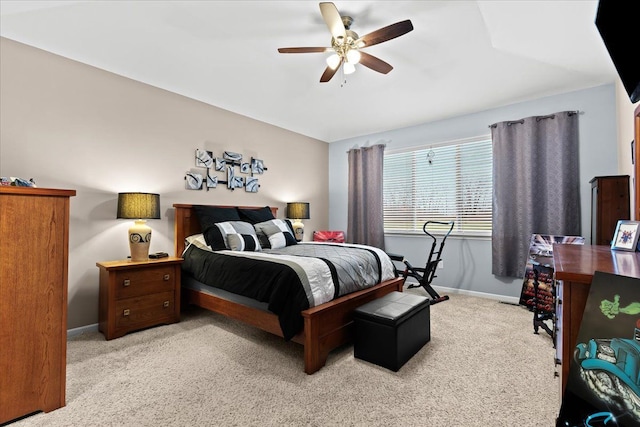 bedroom featuring ceiling fan and light carpet