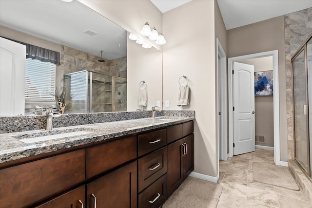 bathroom with vanity and an enclosed shower