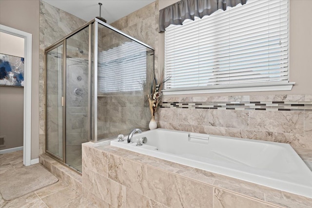 bathroom with separate shower and tub