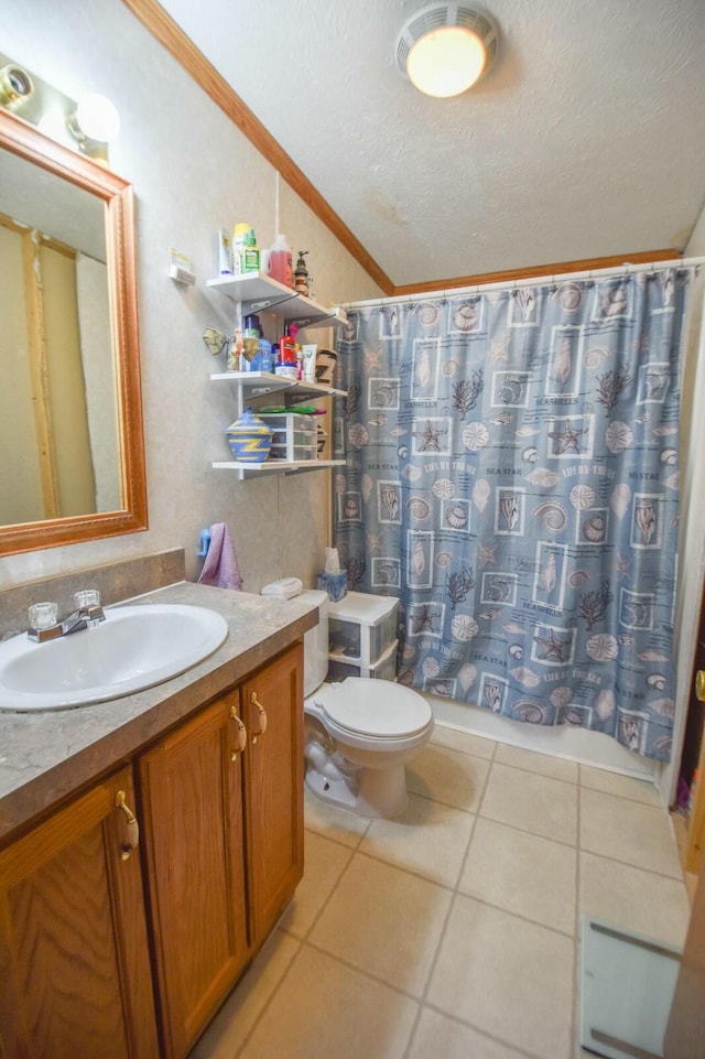 bathroom featuring vanity, tile patterned floors, crown molding, toilet, and a textured ceiling