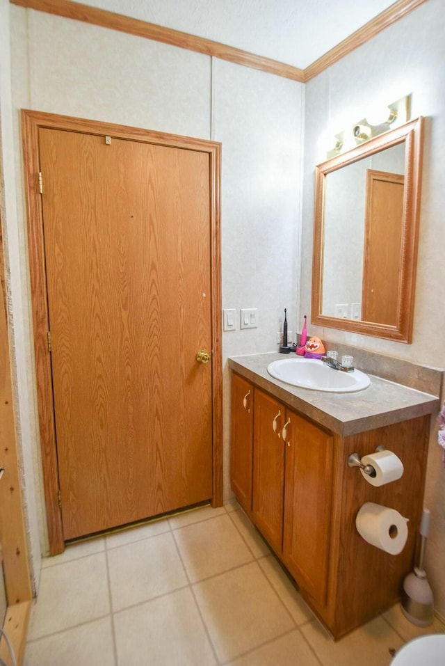 bathroom with vanity, tile patterned floors, and ornamental molding