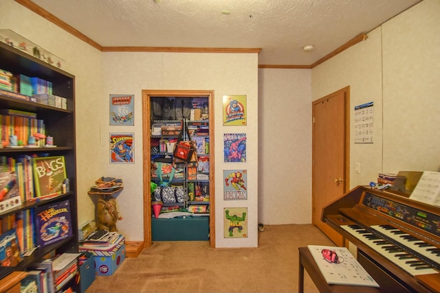 recreation room featuring crown molding, light colored carpet, and a textured ceiling