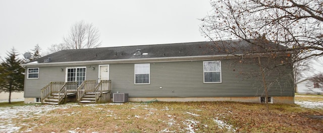 back of property with central air condition unit