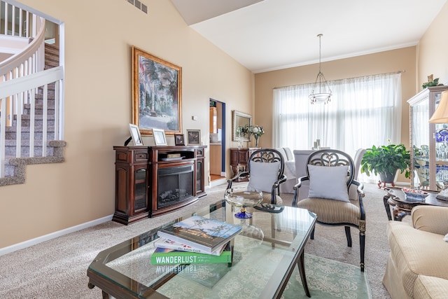 living room featuring carpet floors and a chandelier