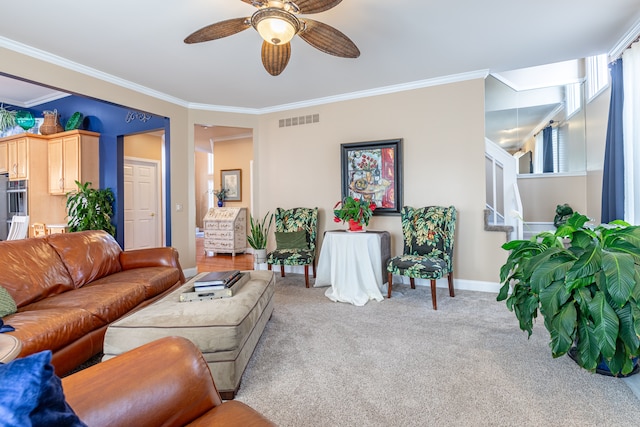 living room with ceiling fan, carpet floors, and crown molding