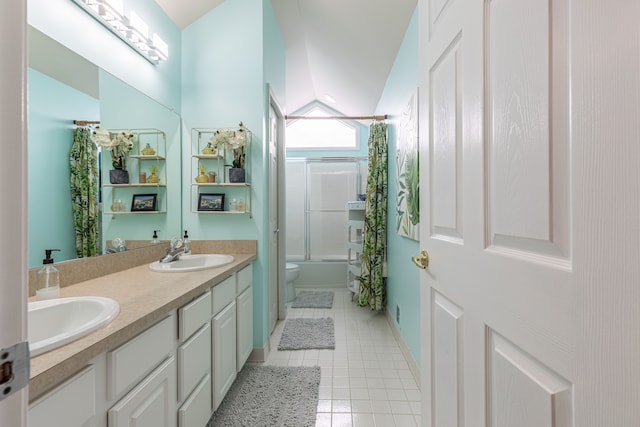 full bathroom featuring vanity, vaulted ceiling, tile patterned flooring, toilet, and shower / bathtub combination