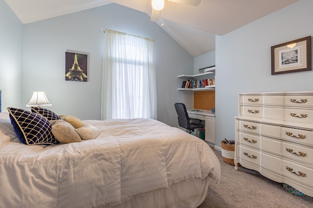 carpeted bedroom featuring vaulted ceiling and ceiling fan