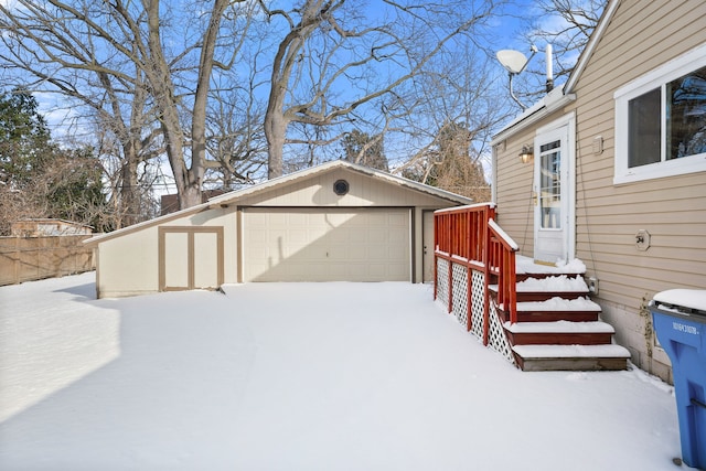 view of snow covered garage