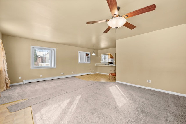 unfurnished living room with light carpet, baseboard heating, and ceiling fan