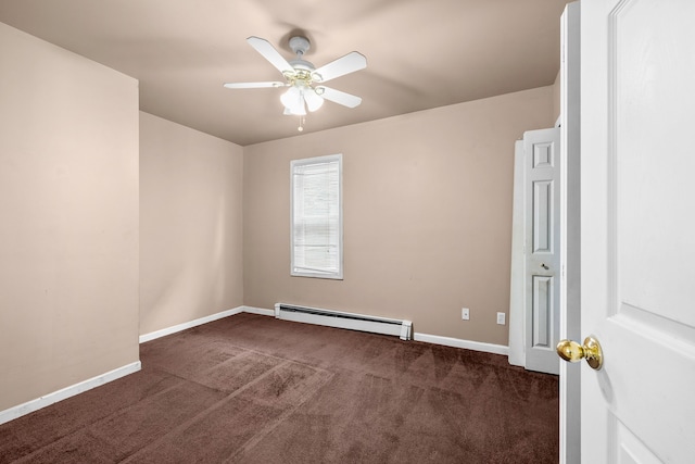 empty room with dark colored carpet, ceiling fan, and a baseboard heating unit