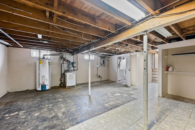 basement featuring washer / dryer and water heater