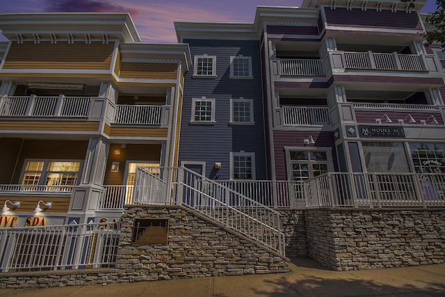 view of outdoor building at dusk