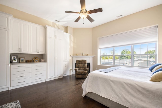 bedroom featuring dark hardwood / wood-style flooring and ceiling fan