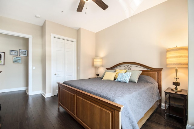 bedroom with ceiling fan, a closet, and dark hardwood / wood-style floors