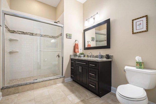 bathroom featuring walk in shower, tile patterned floors, vanity, and toilet