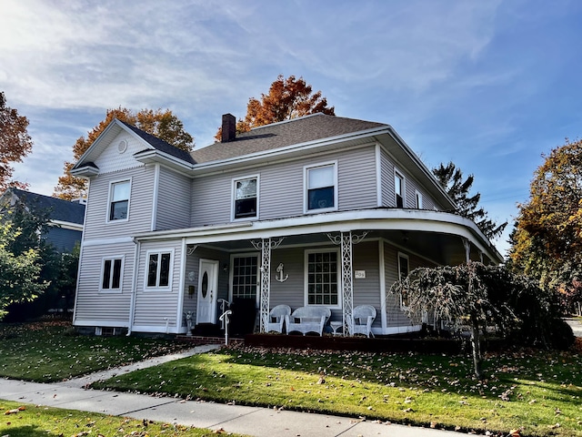 view of front facade featuring a porch and a front lawn