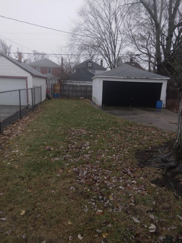 view of yard with a garage and an outdoor structure