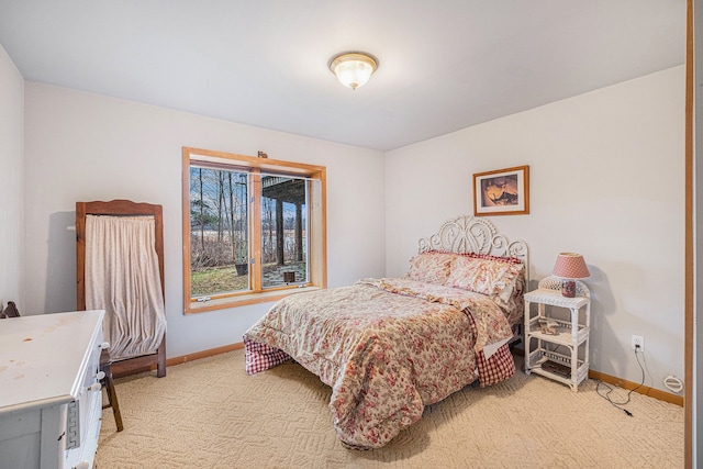 bedroom featuring light colored carpet