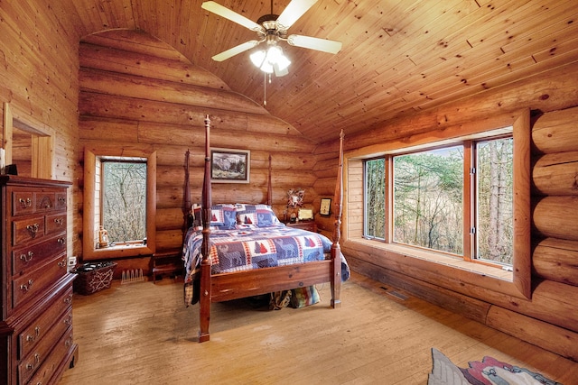 bedroom featuring wood ceiling, ceiling fan, log walls, light hardwood / wood-style floors, and lofted ceiling