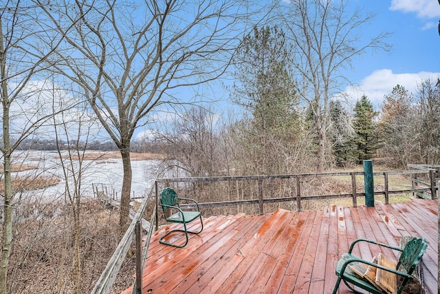 wooden deck featuring a water view