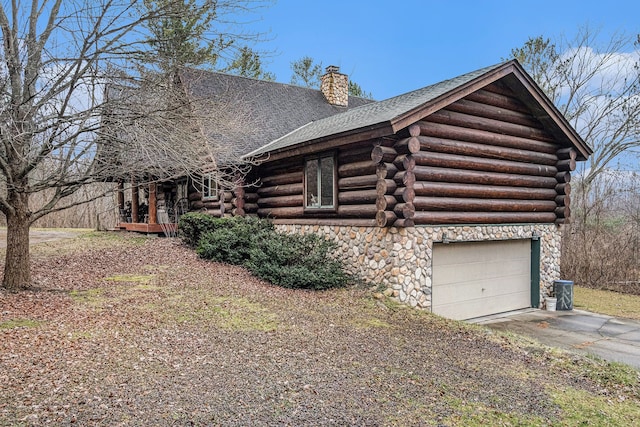 view of side of home with a garage