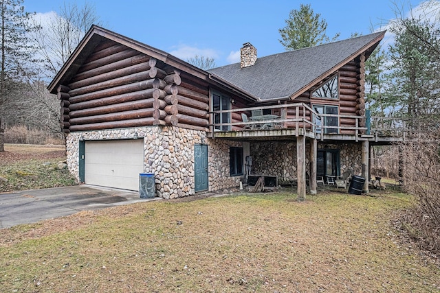 view of front facade with a front yard and a deck