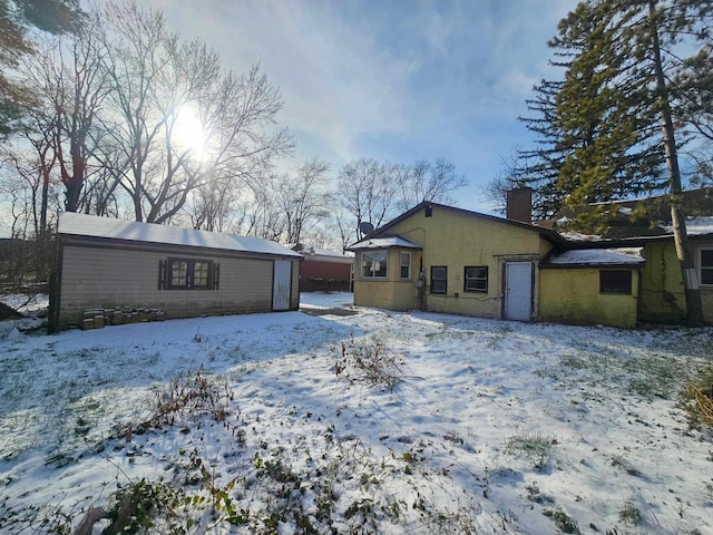 view of snow covered house