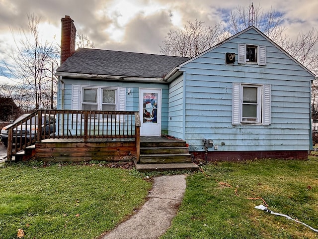 view of front of house with a yard