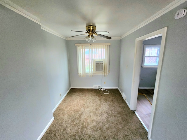 carpeted empty room with ceiling fan and ornamental molding