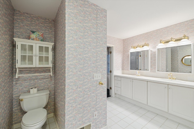 bathroom featuring tile patterned flooring, vanity, and toilet