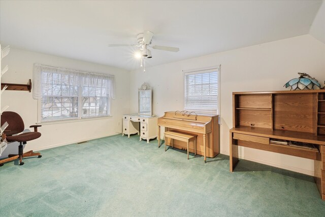 misc room featuring lofted ceiling, dark carpet, and ceiling fan