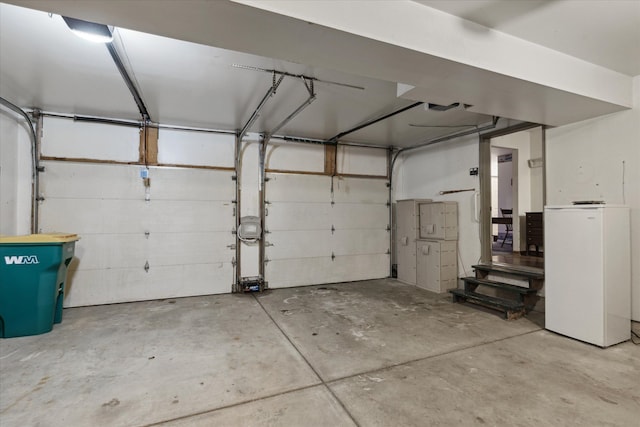 garage featuring white fridge