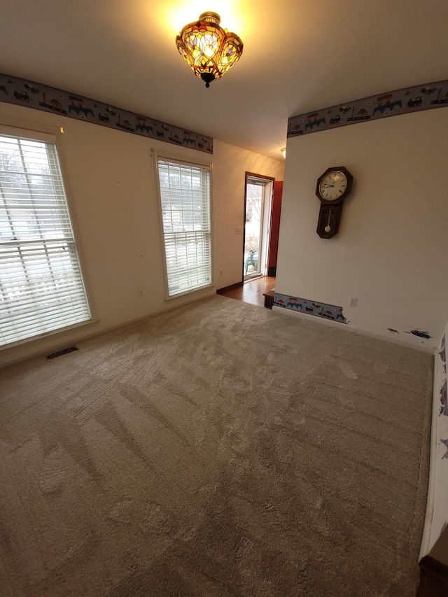 unfurnished living room with carpet floors