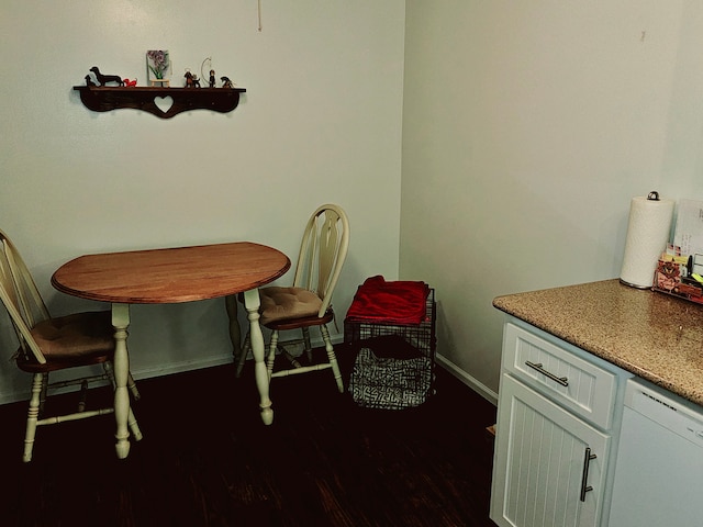 dining room with dark hardwood / wood-style floors