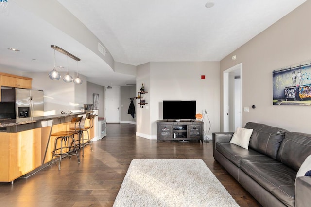 335 Bridge St NW Unit 2602, Grand Rapids, MI 49504 - living area with dark wood finished floors and baseboards