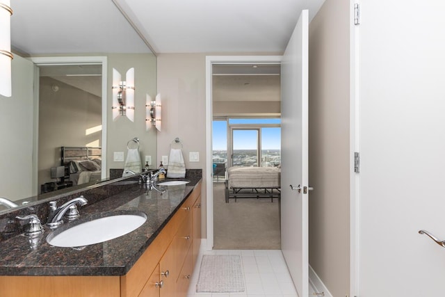 335 Bridge St NW Unit 2602, Grand Rapids, MI 49504 - ensuite bathroom featuring double vanity and tile patterned flooring
