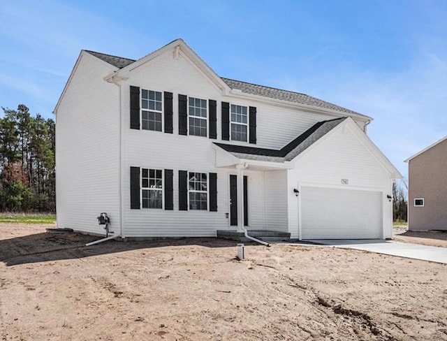7942 Sierra Dr, Belding, MI 48809 - traditional home featuring concrete driveway and an attached garage