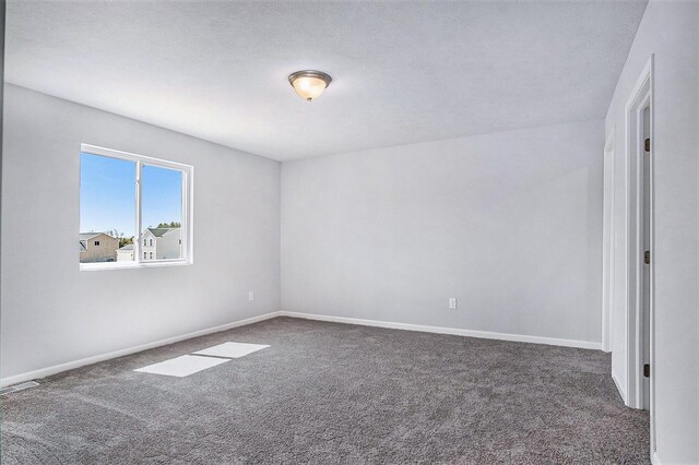 7942 Sierra Dr, Belding, MI 48809 - carpeted empty room featuring baseboards and visible vents