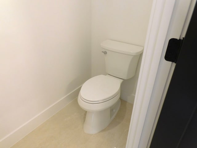 bathroom featuring tile patterned floors and toilet