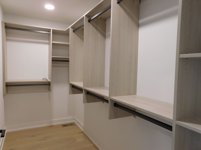 walk in closet featuring light hardwood / wood-style floors