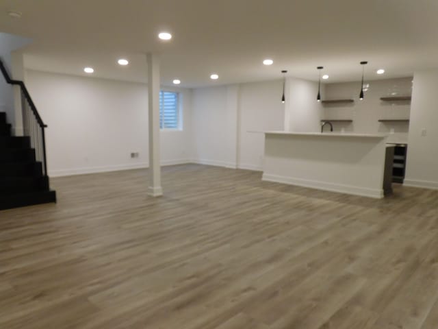 basement with light wood-type flooring