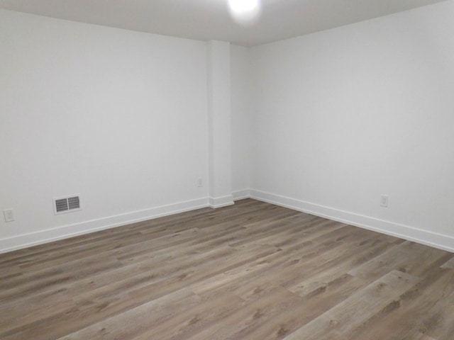 spare room with hardwood / wood-style flooring