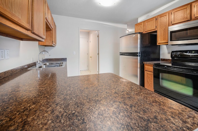 kitchen featuring appliances with stainless steel finishes and sink