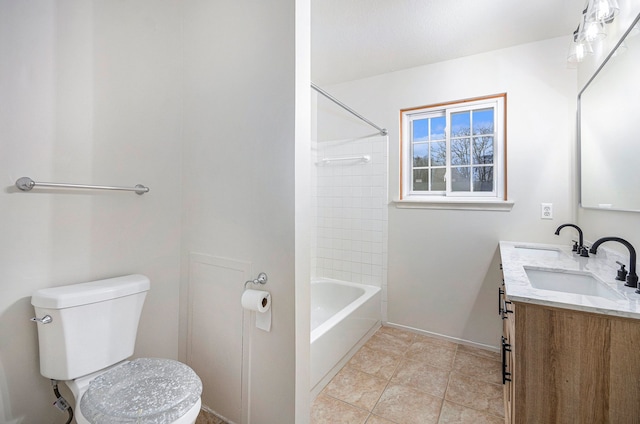 full bathroom featuring tile patterned flooring, vanity, toilet, and tiled shower / bath