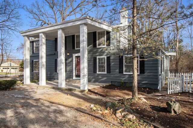 neoclassical / greek revival house featuring a porch