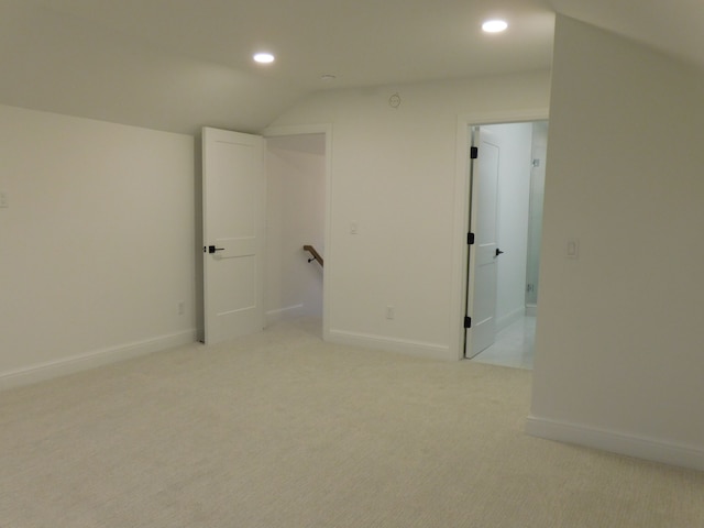 unfurnished room with baseboards, recessed lighting, and light colored carpet