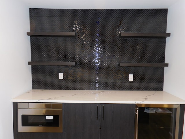 interior details featuring beverage cooler and backsplash